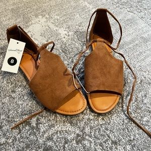 Universal Thread sandals. They have a tie closure and are a faux soft suede.